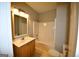 Small bathroom with tub shower combo and single vanity at 4879 Pinnacle Dr, Stone Mountain, GA 30088