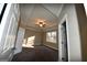 Primary bedroom with carpet, ceiling fan and large window at 4879 Pinnacle Dr, Stone Mountain, GA 30088