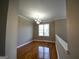 Bright dining room features hardwood floors and a chandelier at 4879 Pinnacle Dr, Stone Mountain, GA 30088