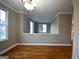 Formal dining room with hardwood floors and a chandelier at 4879 Pinnacle Dr, Stone Mountain, GA 30088