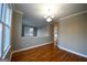 Hardwood floor dining room with crown molding and wainscoting at 4879 Pinnacle Dr, Stone Mountain, GA 30088