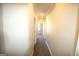 Carpeted hallway with doors to bedrooms at 4879 Pinnacle Dr, Stone Mountain, GA 30088