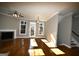 Living room with hardwood floors and fireplace at 4879 Pinnacle Dr, Stone Mountain, GA 30088