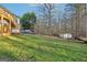 Landscaped backyard, featuring a shed and boat at 718 Grove Pointe Cir, Locust Grove, GA 30248