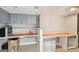 Functional basement with grey cabinets and wood countertops at 718 Grove Pointe Cir, Locust Grove, GA 30248