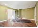 Unfinished basement area with wood flooring and multiple doors at 718 Grove Pointe Cir, Locust Grove, GA 30248