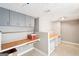 Basement workshop with grey cabinets and wood countertops at 718 Grove Pointe Cir, Locust Grove, GA 30248
