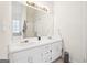 Double vanity bathroom with updated sink and mirror at 718 Grove Pointe Cir, Locust Grove, GA 30248