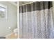 Small bathroom with shower and patterned curtain at 718 Grove Pointe Cir, Locust Grove, GA 30248