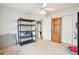 Storage-rich bedroom featuring a gun cabinet and shelving at 718 Grove Pointe Cir, Locust Grove, GA 30248