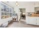 Breakfast nook with view into Gathering room and access to backyard at 718 Grove Pointe Cir, Locust Grove, GA 30248