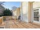 Relaxing deck with rocking chair, offering peaceful backyard views at 718 Grove Pointe Cir, Locust Grove, GA 30248