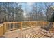 Wooden deck overlooking a wooded backyard, perfect for relaxing at 718 Grove Pointe Cir, Locust Grove, GA 30248