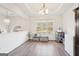 Bright dining room with window, hardwood floor and storage at 718 Grove Pointe Cir, Locust Grove, GA 30248