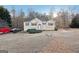 Ranch style home with a large yard and mature trees at 718 Grove Pointe Cir, Locust Grove, GA 30248