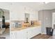 White kitchen with wood countertops, tile backsplash and stainless steel appliances at 718 Grove Pointe Cir, Locust Grove, GA 30248