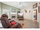 Spacious living room with a fireplace, large TV, and comfortable seating at 718 Grove Pointe Cir, Locust Grove, GA 30248