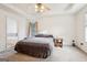 Main bedroom with carpet, ceiling fan, and en-suite bathroom at 718 Grove Pointe Cir, Locust Grove, GA 30248