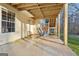 Covered patio with swing, providing shaded outdoor space at 718 Grove Pointe Cir, Locust Grove, GA 30248