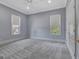 Bright bedroom with neutral walls and carpet flooring at 145 Havenbrooke Ct, Fayetteville, GA 30214