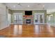 Spacious living room with stone fireplace and hardwood floors at 145 Havenbrooke Ct, Fayetteville, GA 30214