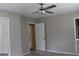Bedroom with ceiling fan and access to bath at 2405 Falls River Dr, Lithia Springs, GA 30122
