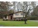 Ranch style home with brick and siding exterior, nicely landscaped lawn at 2405 Falls River Dr, Lithia Springs, GA 30122