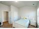 Bright bedroom with a single bed, white furniture, carpeted floors, and natural light at 5345 Bucknell Trce, Cumming, GA 30028