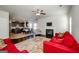Open concept living room with a fireplace and views of the kitchen and dining area with modern decor at 5345 Bucknell Trce, Cumming, GA 30028
