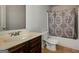 Bathroom featuring vanity with a dark wood cabinet, a toilet, and a shower tub at 5345 Bucknell Trce, Cumming, GA 30028