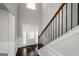 Light-filled entryway with hardwood flooring, neutral paint and trim that provides a welcoming ambiance at 5345 Bucknell Trce, Cumming, GA 30028