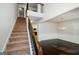 Bright foyer with stairway, hardwood floors, and a decorative chandelier that enhances the entrance at 5345 Bucknell Trce, Cumming, GA 30028