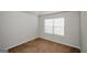 Neutral bedroom with plush carpeting, window, and simple modern decor at 5345 Bucknell Trce, Cumming, GA 30028