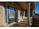 Inviting front porch with brick facade, neutral trim, and a covered entryway offering curb appeal at 5345 Bucknell Trce, Cumming, GA 30028