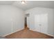 Clean bedroom features plush carpeting, and closet with view to hallway at 5345 Bucknell Trce, Cumming, GA 30028