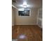 Finished basement room with hardwood floors and a window at 793 Pixley Dr, Riverdale, GA 30296