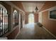 Inviting covered porch with arched entryways and ornate iron railings at 793 Pixley Dr, Riverdale, GA 30296