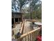 Spacious wooden deck with ample seating and backyard access at 793 Pixley Dr, Riverdale, GA 30296
