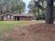 Brick ranch house with a large front yard and mature trees at 793 Pixley Dr, Riverdale, GA 30296