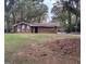 Brick ranch house with a large front yard and mature trees at 793 Pixley Dr, Riverdale, GA 30296