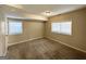 Bright basement bedroom featuring neutral carpeting and window blinds at 3245 Bunny Ln, Decatur, GA 30034