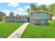 Gray exterior house with landscaped lawn and walkway at 3245 Bunny Ln, Decatur, GA 30034