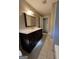 Bathroom with vanity, mirror, and tile floor at 6074 Shallow Wood Ln, Douglasville, GA 30135