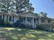 Ranch style home with mature trees and landscaping at 6074 Shallow Wood Ln, Douglasville, GA 30135