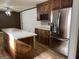 Kitchen boasts an island and stainless steel appliances at 6074 Shallow Wood Ln, Douglasville, GA 30135