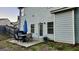 Small patio with a table and chairs, umbrella, and gas grill at 2408 Centenary Way Ct, Dacula, GA 30019