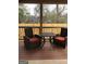 Relaxing back deck with patio furniture and wood railing, offering a view of the backyard at 1420 Donnelly Ave, Atlanta, GA 30310