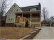 Two-story house with driveway, front porch and landscaped yard at 1420 Donnelly Ave, Atlanta, GA 30310