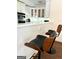 Kitchen with breakfast bar and two mid-century modern barstools at 1420 Donnelly Ave, Atlanta, GA 30310