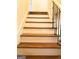 Modern staircase with dark wood and metal railing at 1420 Donnelly Ave, Atlanta, GA 30310